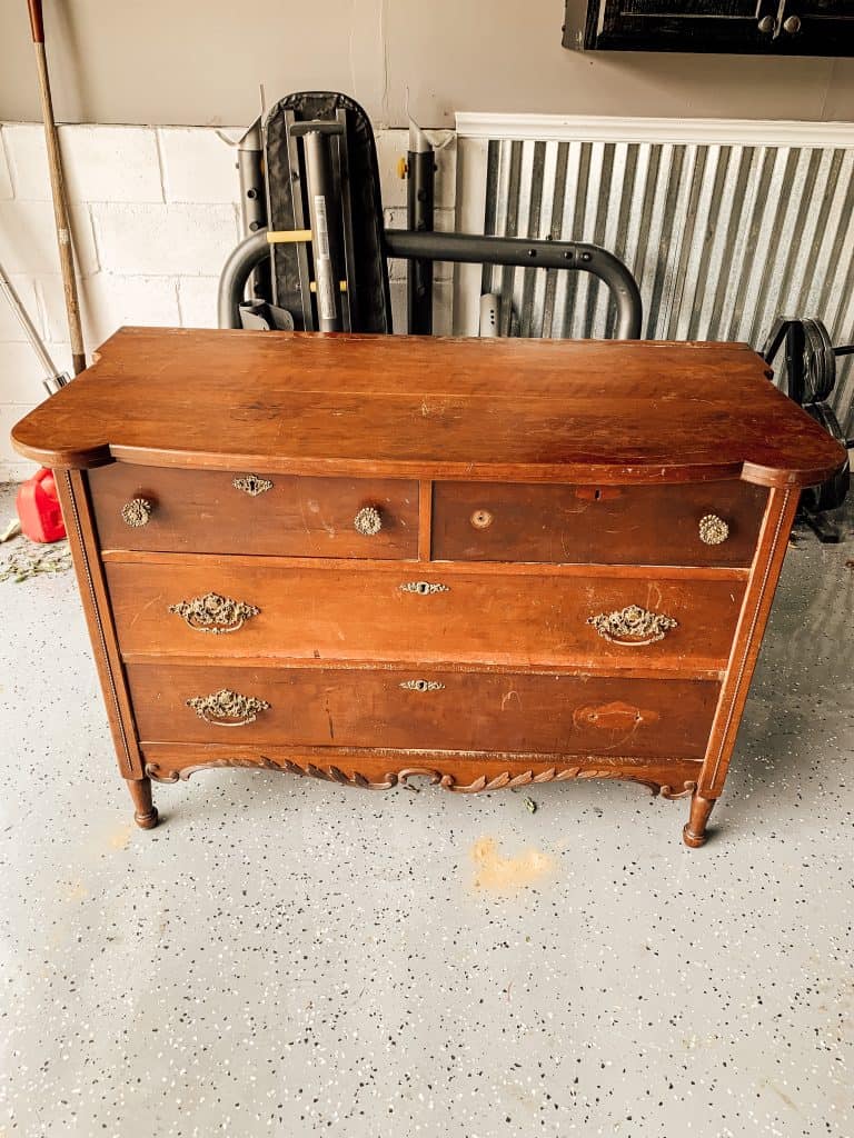 Vintage dresser sitting in garage